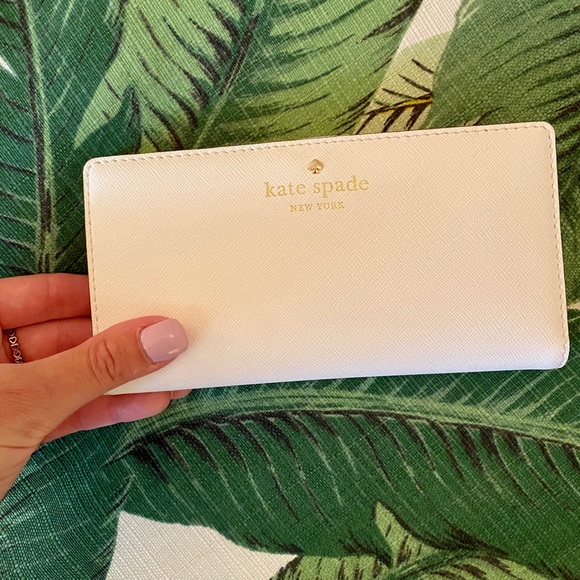 kate spade Handbags - NWOT Kate Spade White bifold wallet
